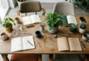 Team table with notebooks and plants from above