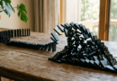 Dominoes toppling into a triangle